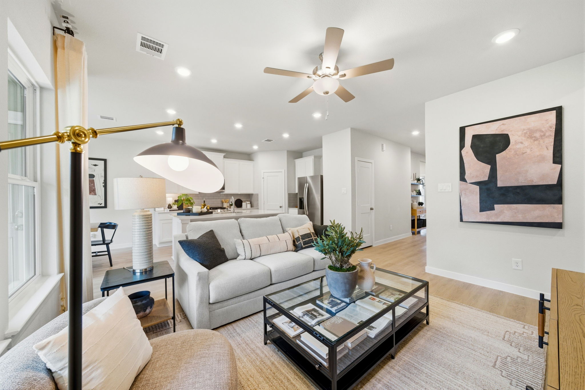 A living room with a ceiling fan.