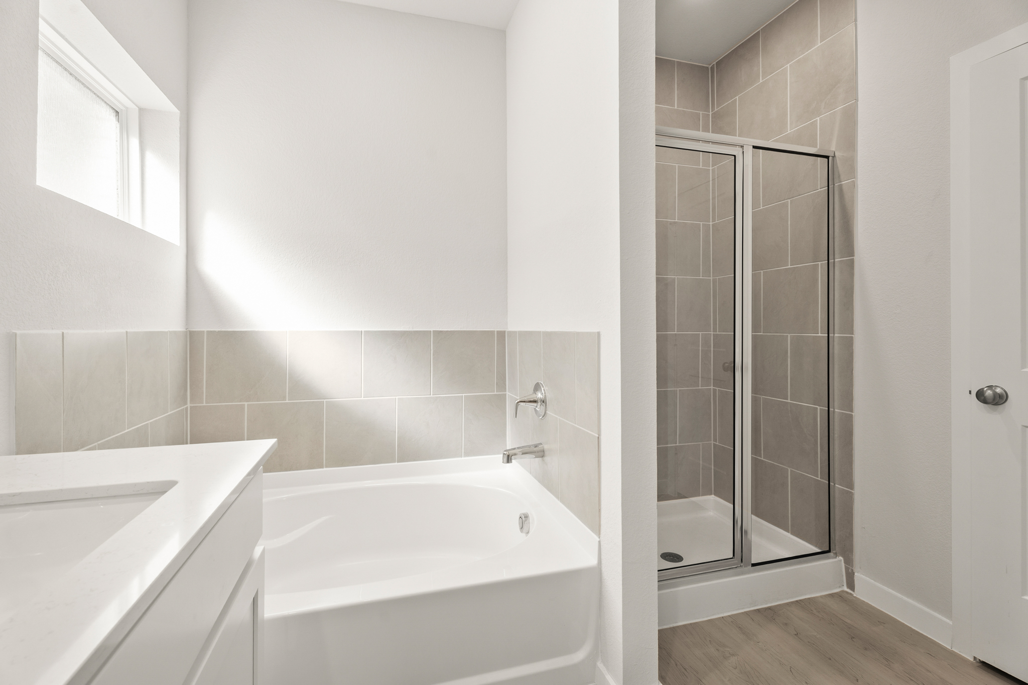 A bathroom with a glass shower.