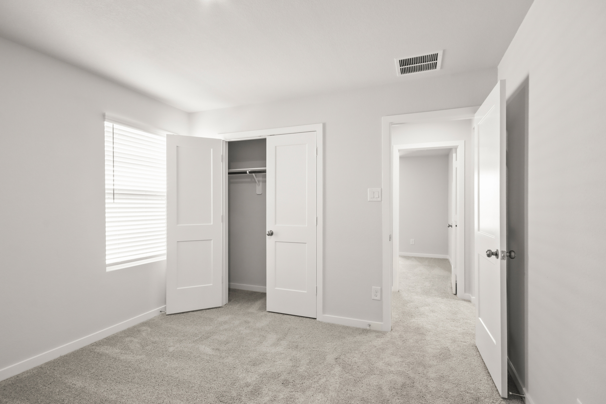 A room with white doors.
