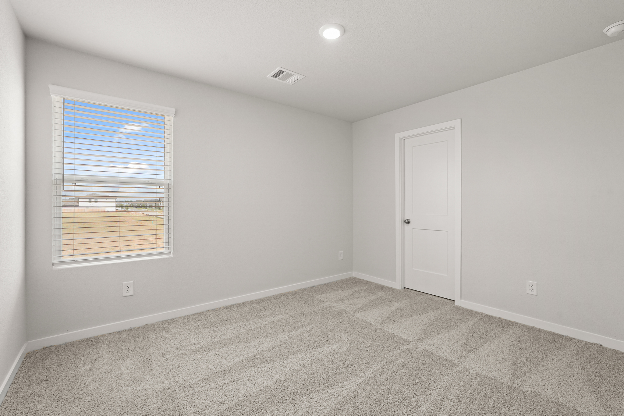 A room with a door and a window.