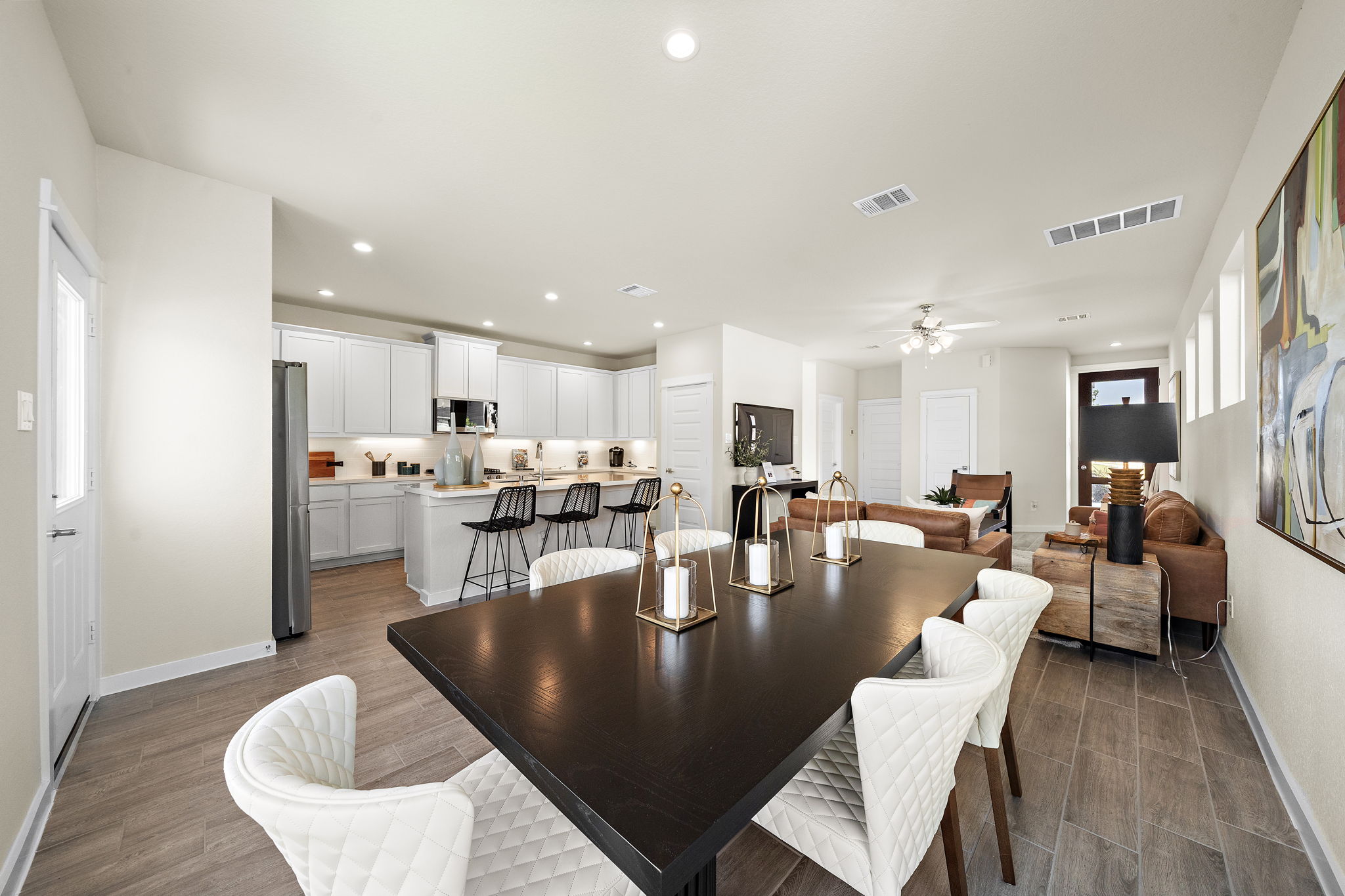 A large dining room with a large table and chairs.