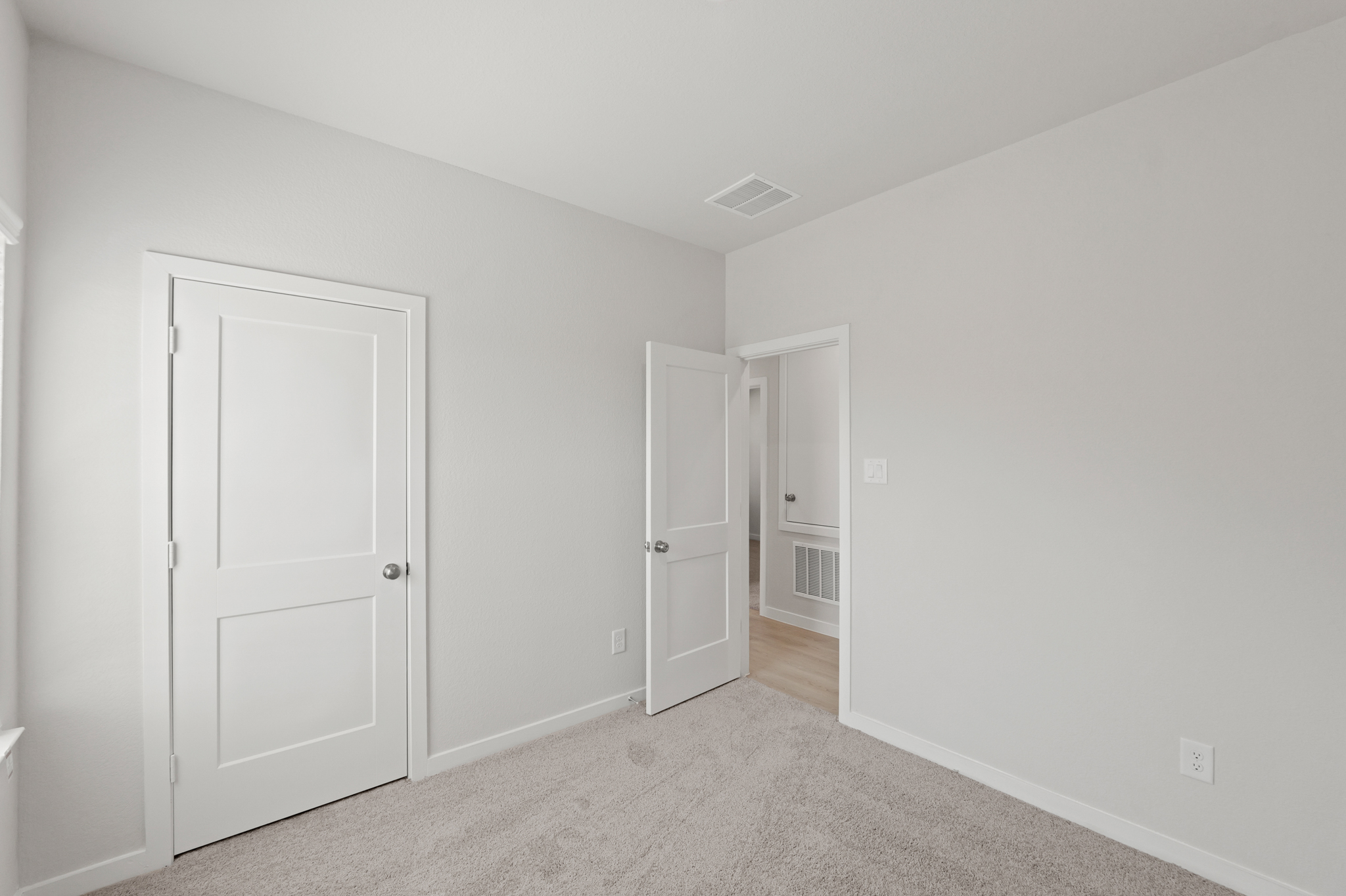 A room with white doors.