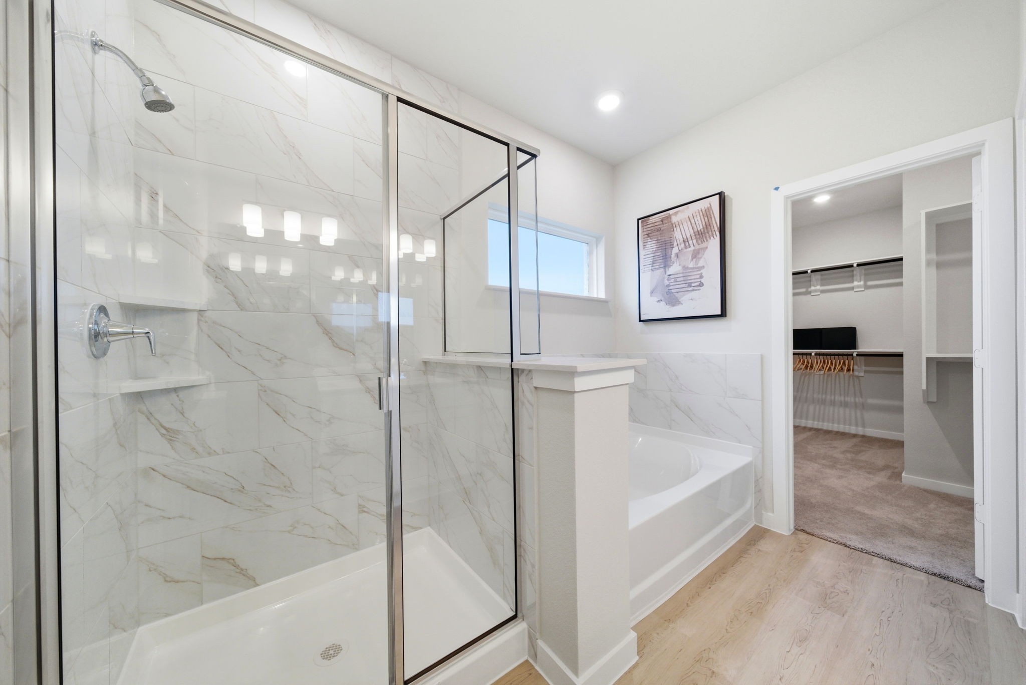 A bathroom with a glass shower.