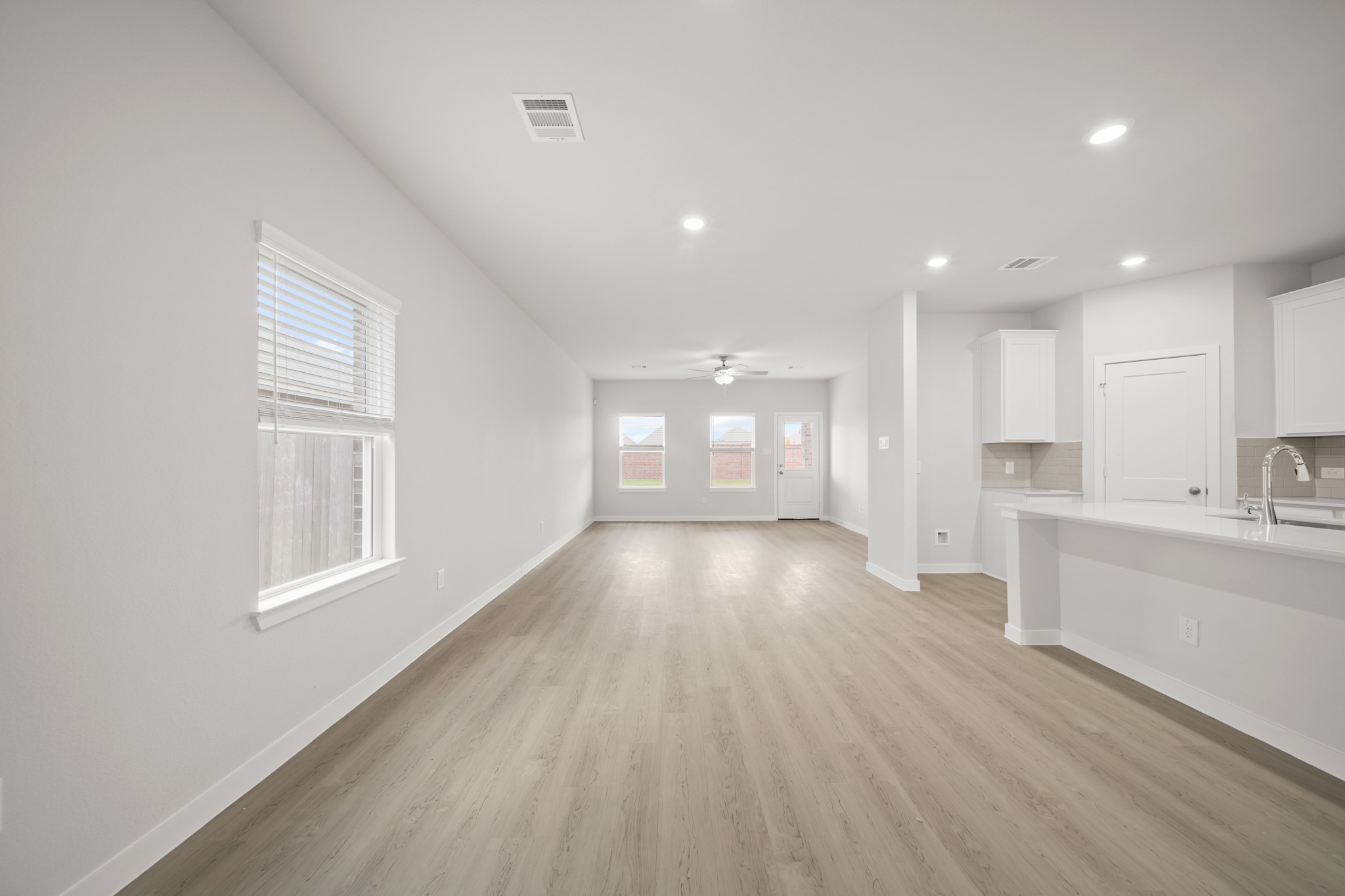 A kitchen with white walls.