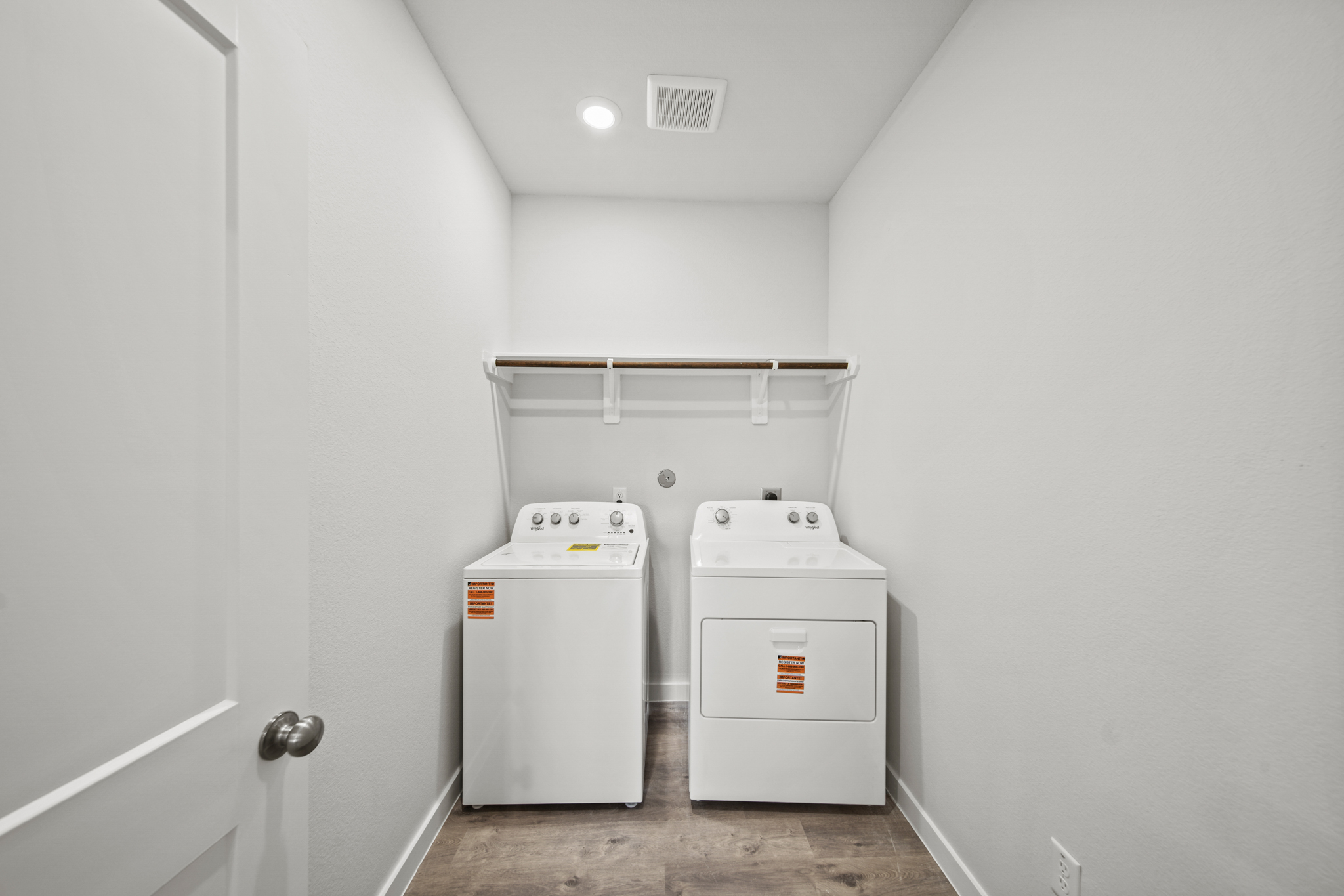 A laundry room with a washer and dryer.
