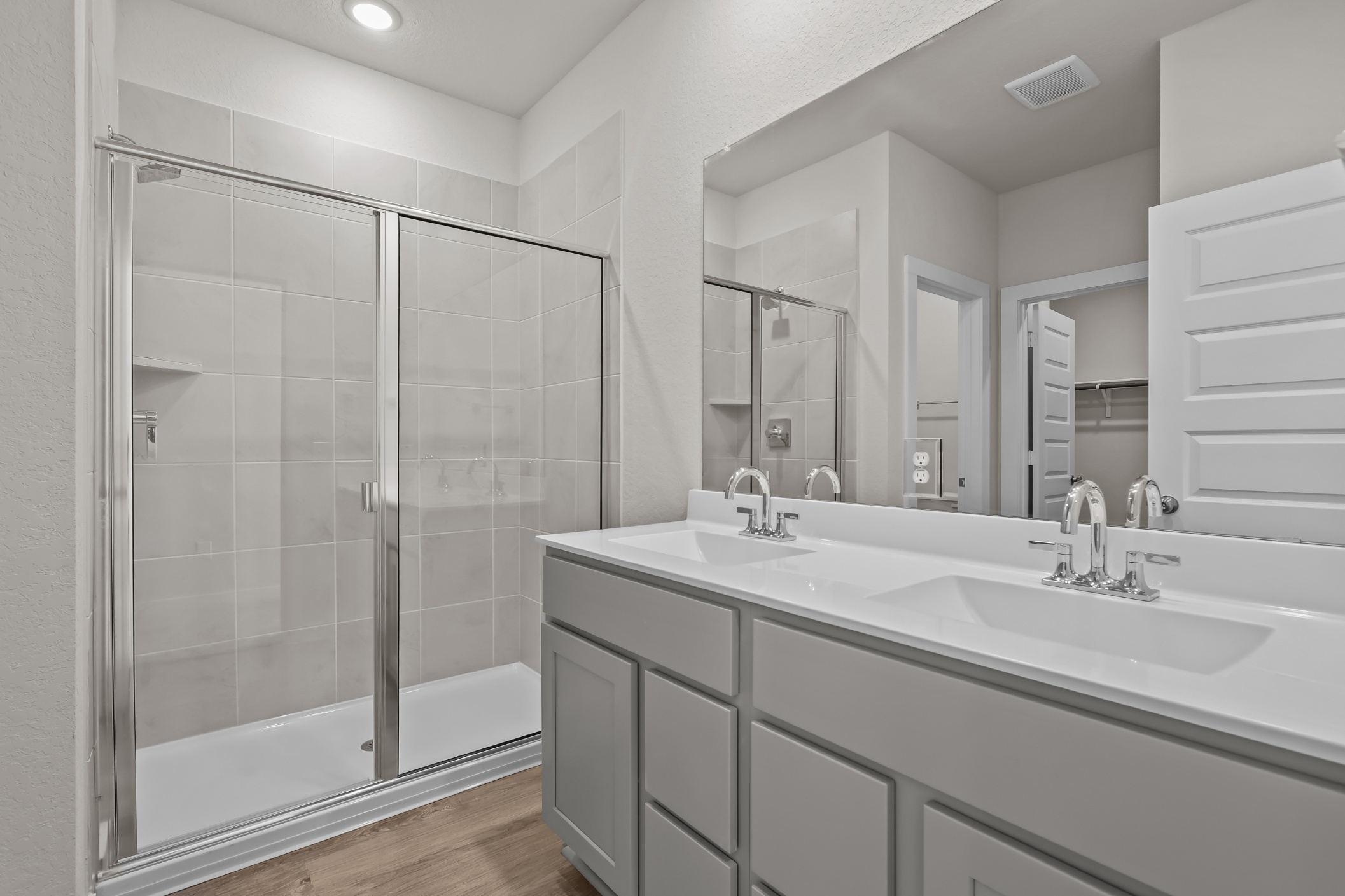 A bathroom with a glass shower.