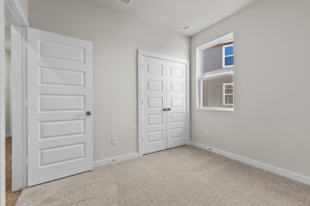 A room with white doors.