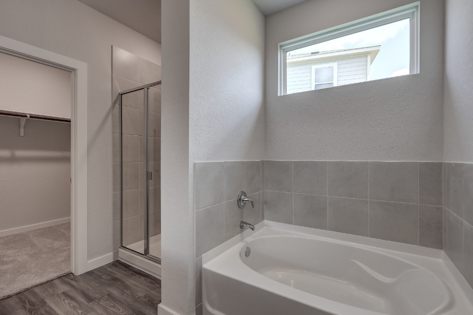 A bathroom with a glass shower.