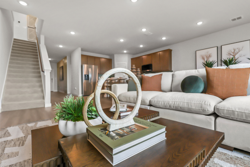 A living room with a couch and a table.