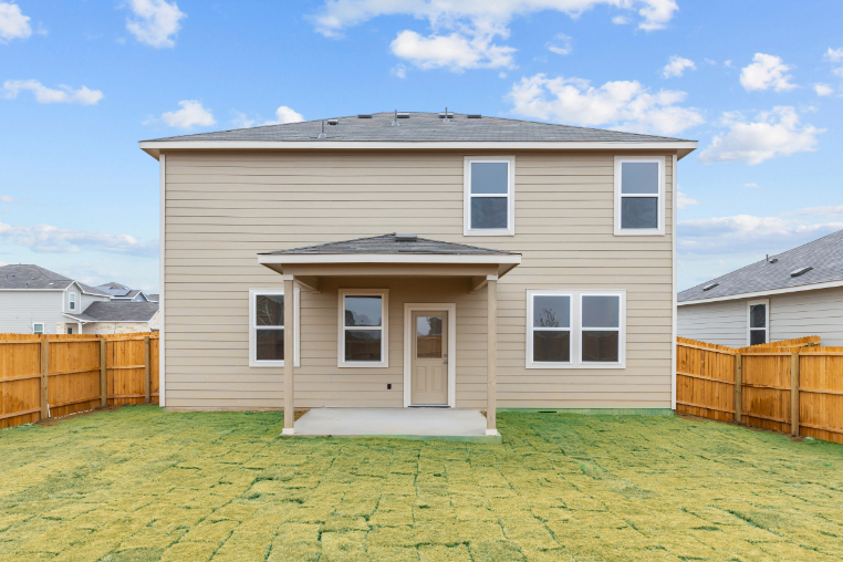 A house with a fence around it.