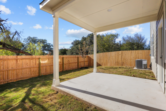 A deck with a fence and a wood fence and a wood fence.