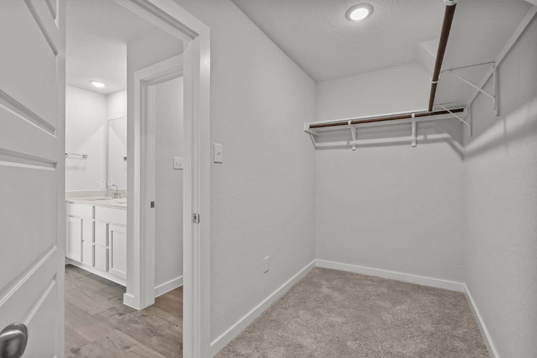 A bathroom with white walls.