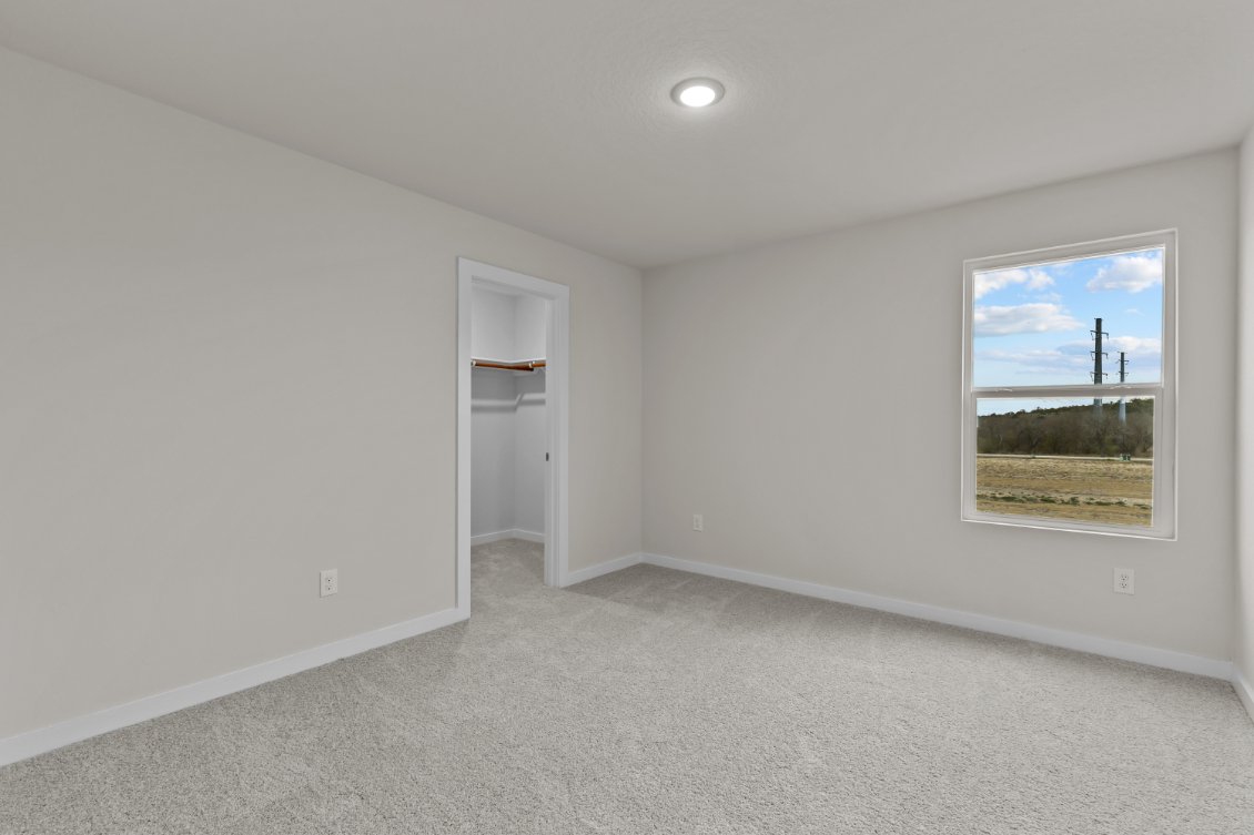 A room with a painting on the wall.