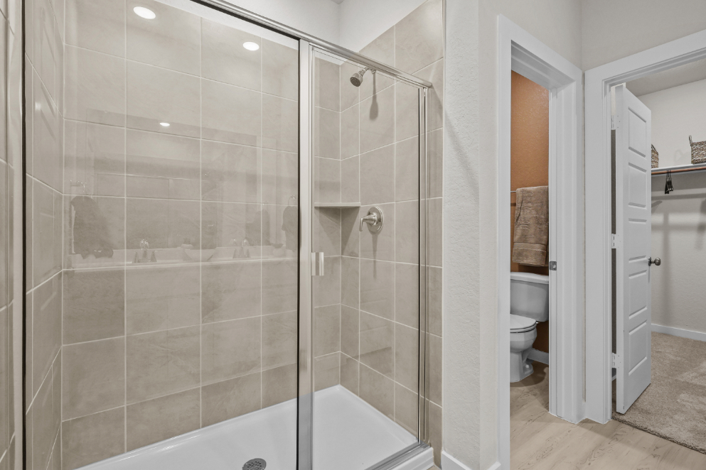 A bathroom with a glass shower.