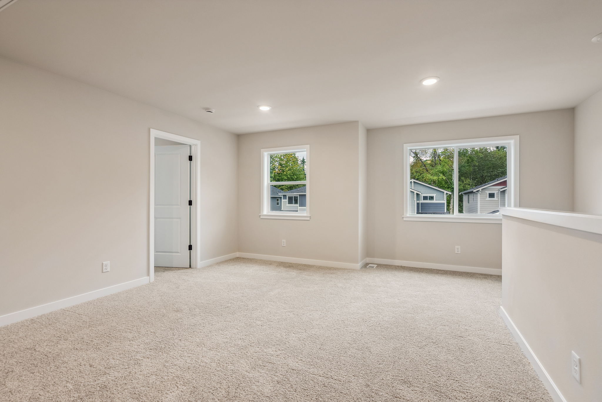 A room with a white floor and windows.