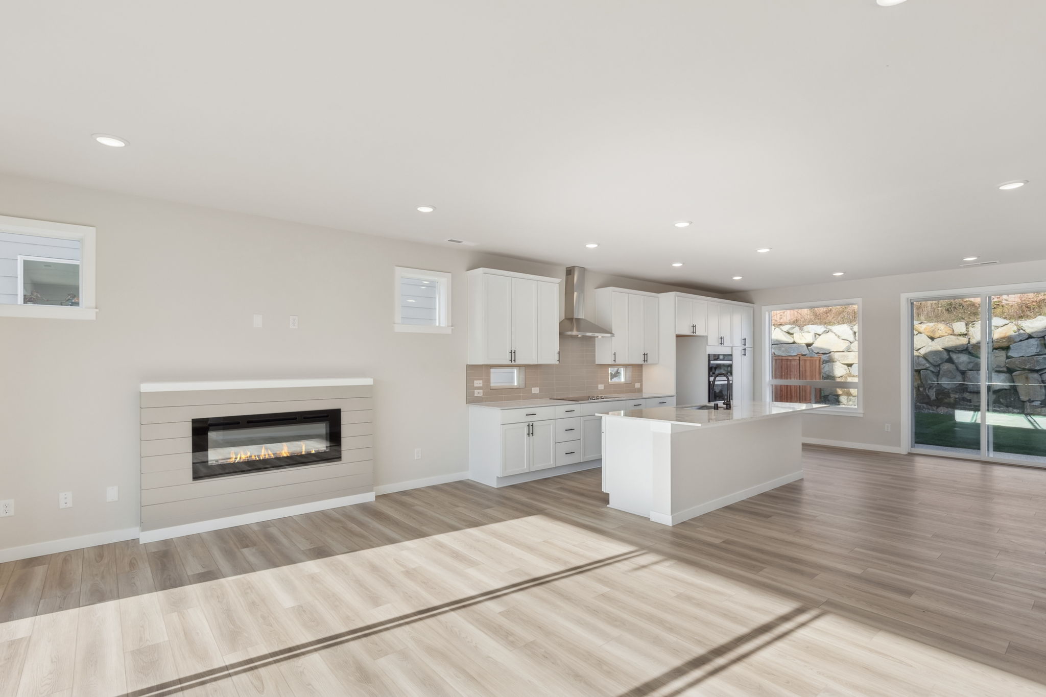 A kitchen with a fireplace.