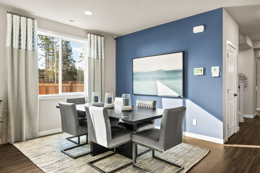 A room with a table and chairs.