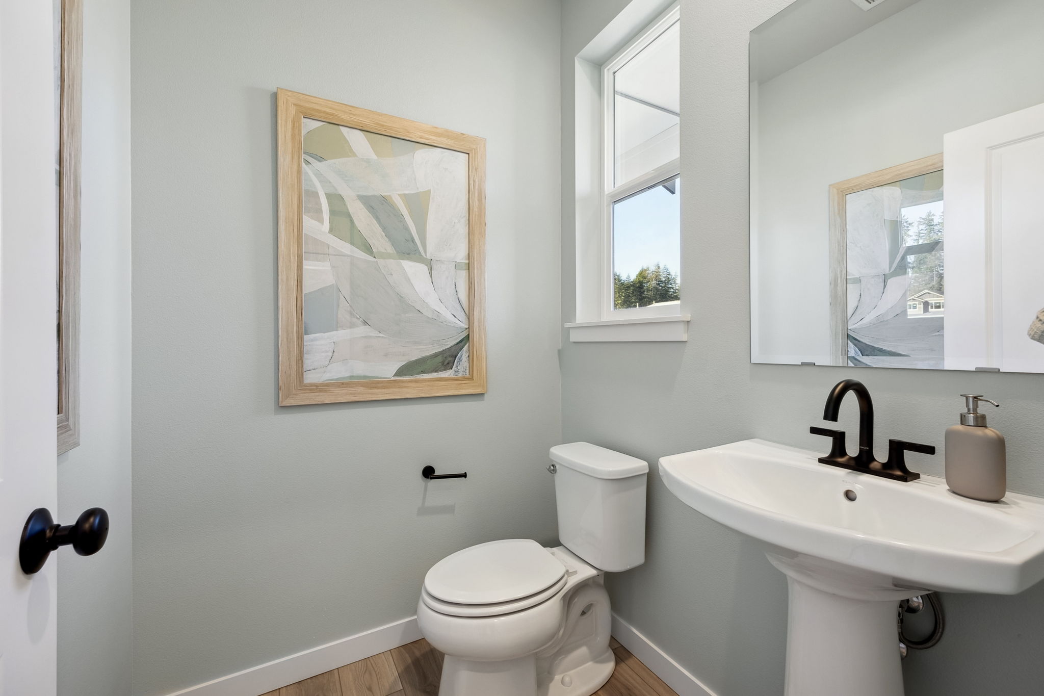 A bathroom with a toilet and sink.
