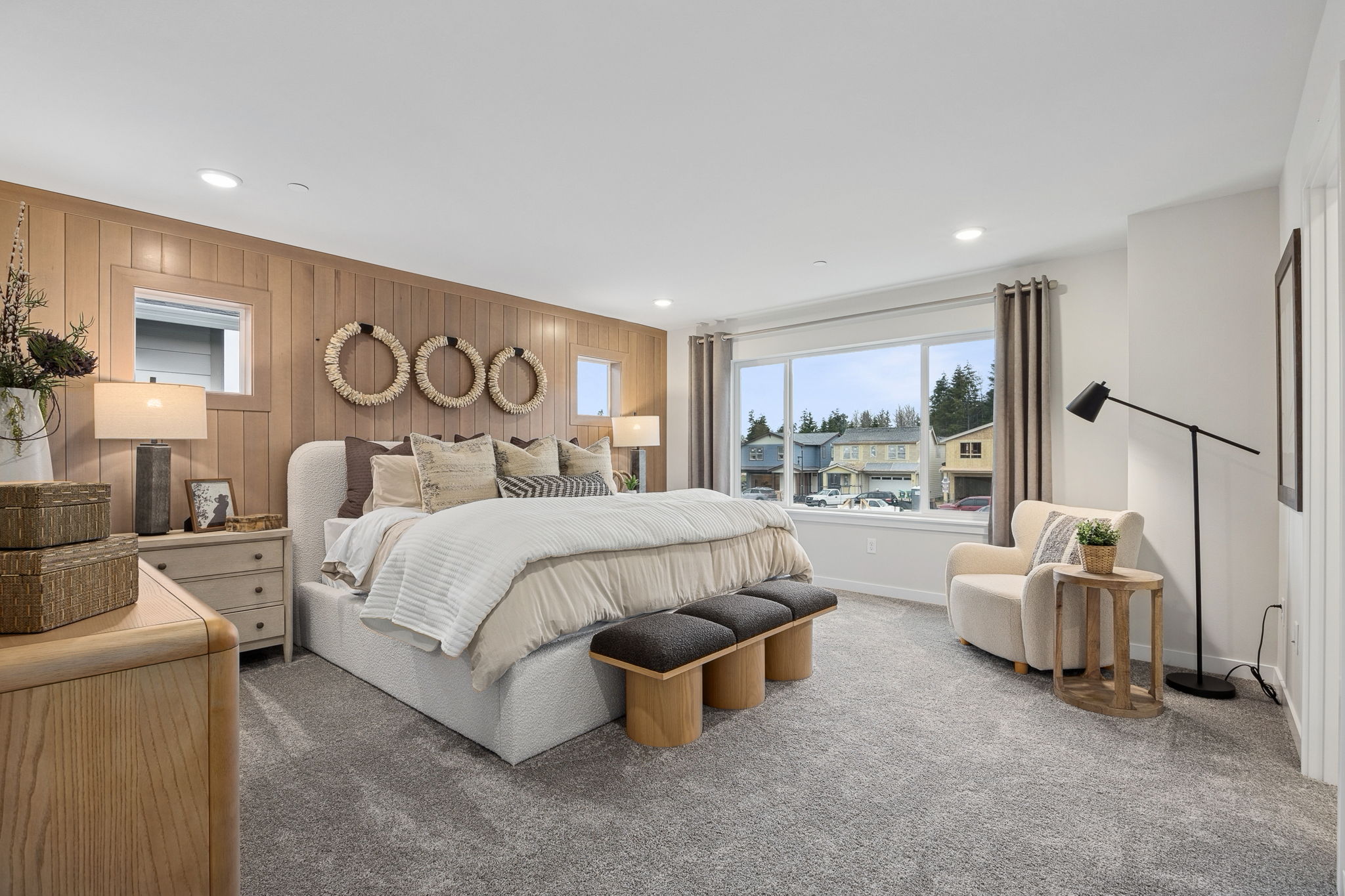 A large living room with a large window.