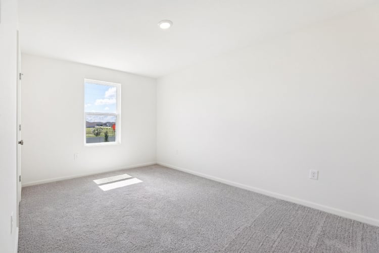 A room with a painting on the wall.