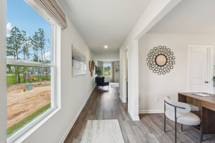 A room with a table and chairs.