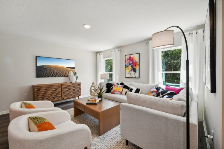 A living room with a couch and a table.