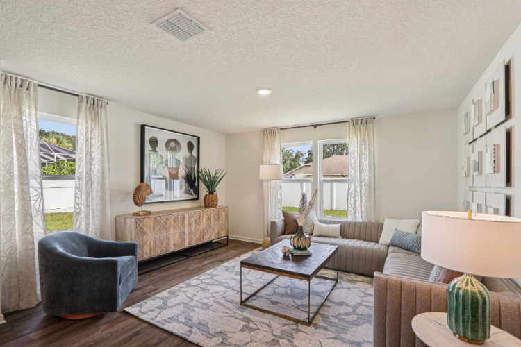 A living room with a bed and a couch.
