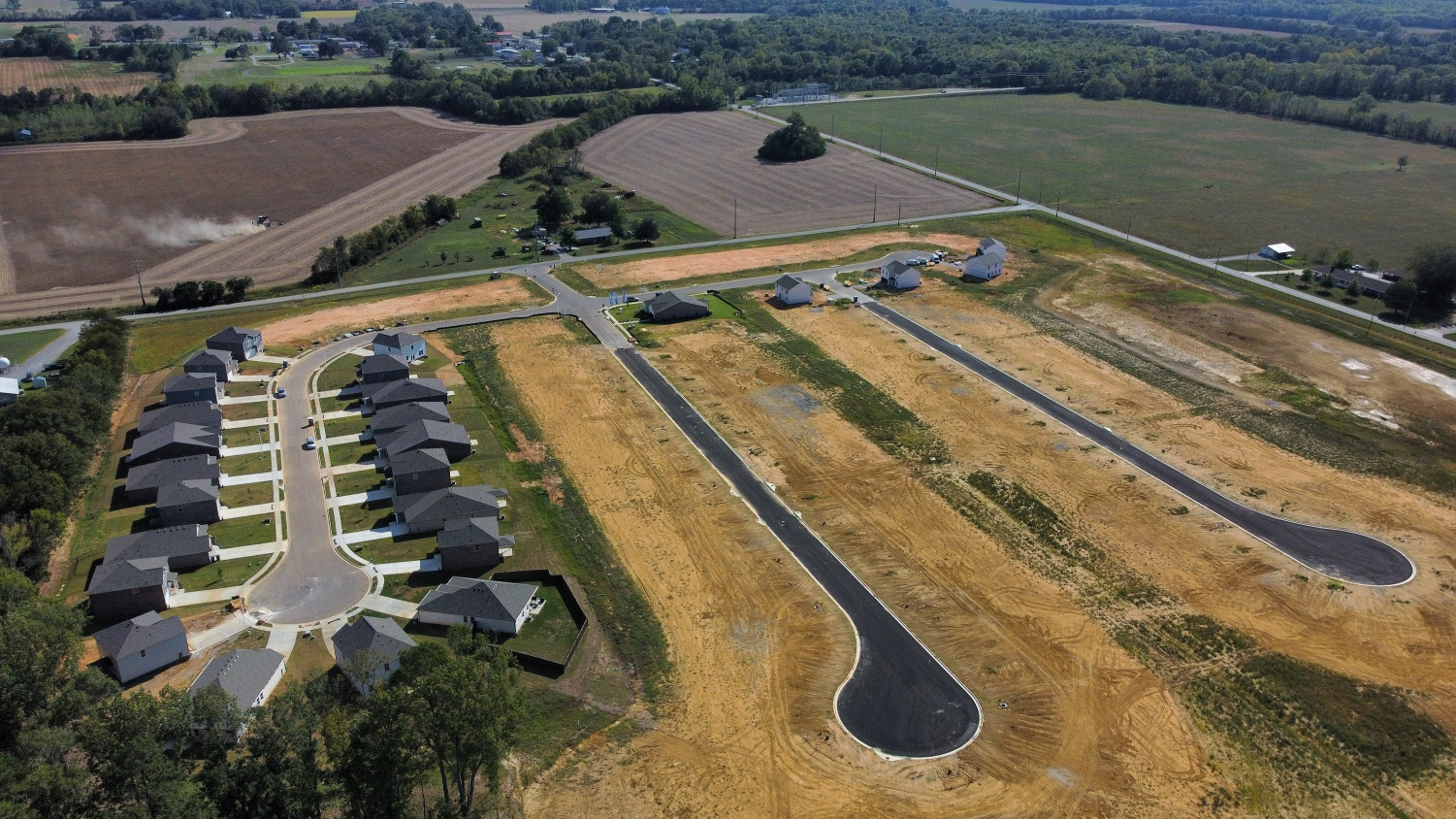 A farm with many rows of crops.