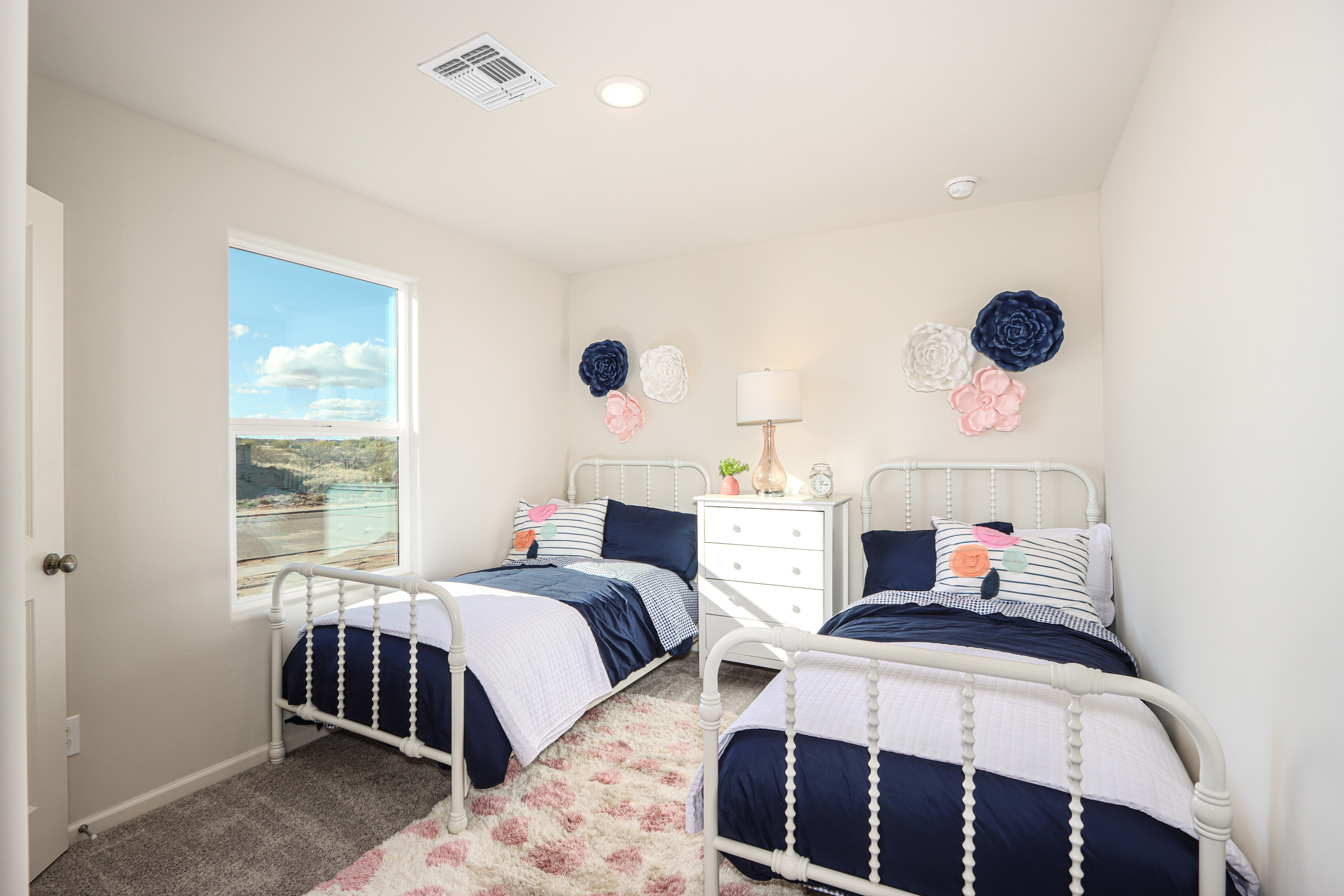 A bedroom with two beds.