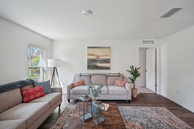 A living room with a couch and a coffee table.