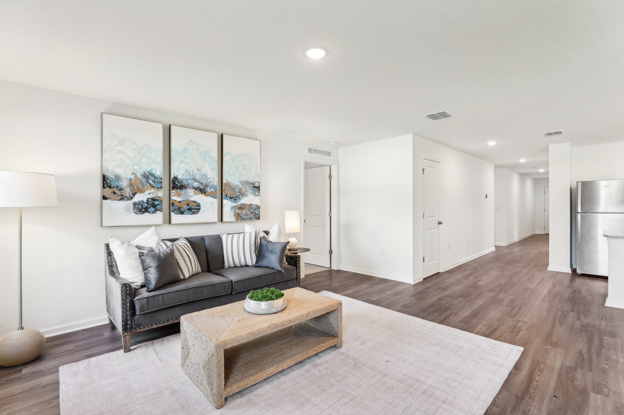 A living room with a couch and a coffee table.