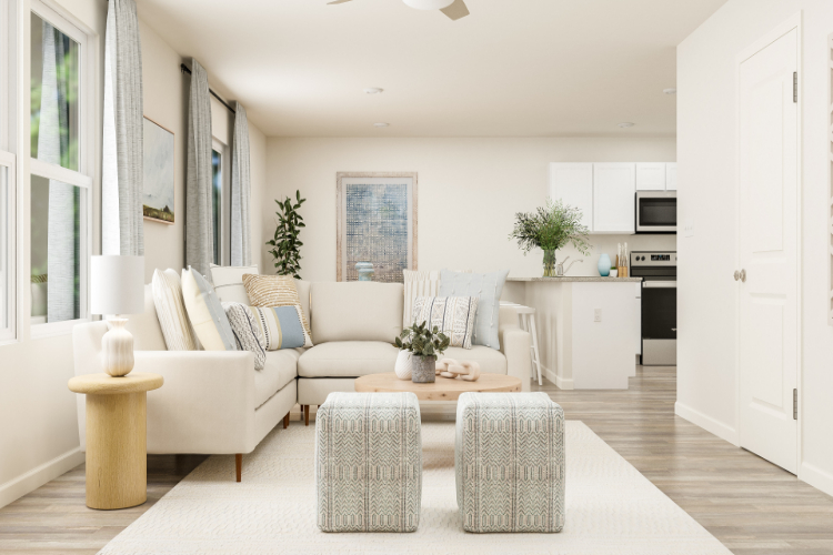 A living room with white furniture.